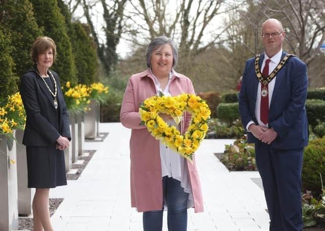 In 2021 the then mayoral team of Antrim and Newtownabbey Council, presented Brenda Doherty with a floral wreath in remembrance of all those who lost their lives during the pandemic.