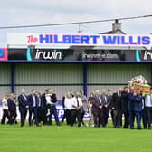 The funeral cortege of Hilbert Willis makes its way into Loughgall Football Club for a final lap of Lakeview Park on Tuesday. Picture: Arthur Allison / Pacemaker Press.