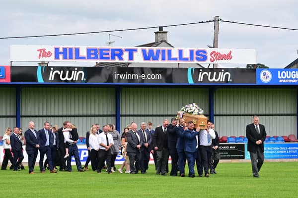 The funeral cortege of Hilbert Willis makes its way into Loughgall Football Club for a final lap of Lakeview Park on Tuesday. Picture: Arthur Allison / Pacemaker Press.
