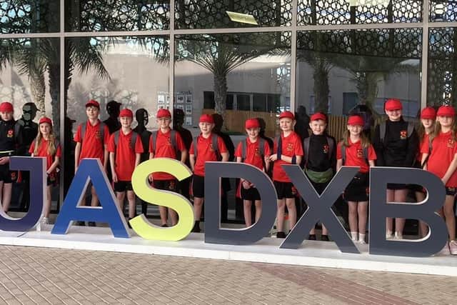 The Banbridge pupils and staff pictured outside Jebel Ali School (JAS) in Dubai.