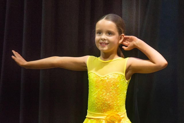 Lily McAtarsney goes through her routine in the Novice Tap Solo 7-8 years competition at Portadown Dance Festival. PT18-203.