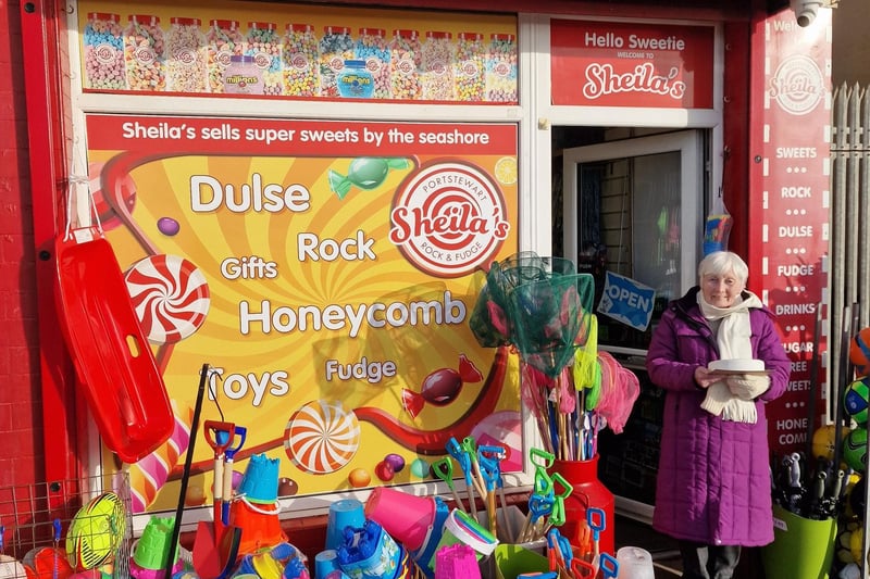 Sheila Conway pictured outside the shop last week with the 60th birthday cake