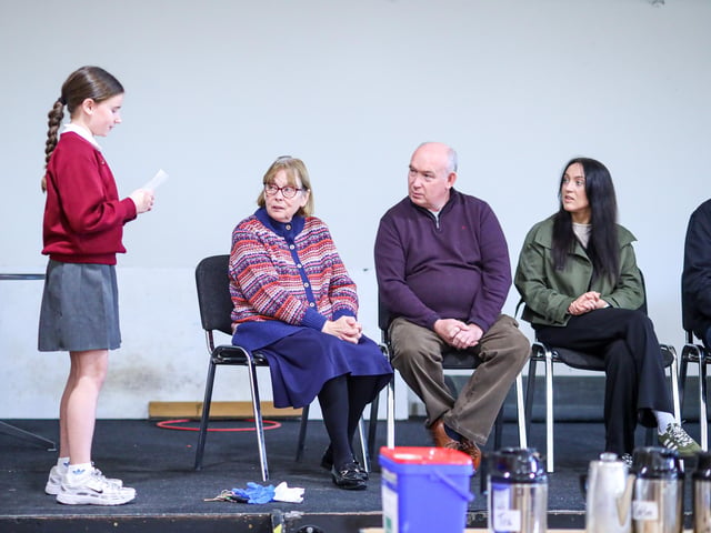 A pupil puts a question to the political representatives during the Coffee Morning.