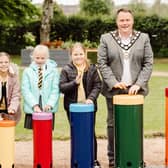 Mayor, Cllr Mark Cooper is joined by children from Doagh Primary School