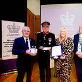 The Lord-Lieutenant of County Antrim, David McCorkell KStJ and Mayor of Antrim and Newtownabbey Borough Council present Chair of RUSCS, Sheldon Murray and the Secretary, Wendy Kerr with the King’s Award Crystal and Citation