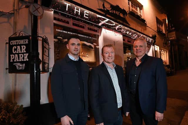 Celebrating the completion of the deal are Richard Patterson (centre) with new owners Ryan McGlone (left) and Henry McGlone (right). The McGlone family brings a wealth of industry experience to The Plough Inn having successfully founded and developed a number of venues in the mid Ulster area, including Dormans, Mary’s Bar and Secrets.  Pic credit: Duffy Rafferty