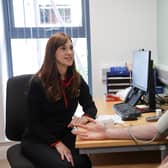 25-year-old Chris Kelly from South Belfast gets his blood pressure checked by Hannah Glasgow (Health Improvement Officer, Action Cancer) as part of his MOT health check.