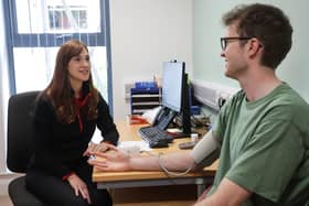 25-year-old Chris Kelly from South Belfast gets his blood pressure checked by Hannah Glasgow (Health Improvement Officer, Action Cancer) as part of his MOT health check.