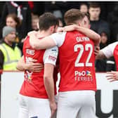 Larne players celebrate Andy Ryan's goal. (Pic by Pacemaker).