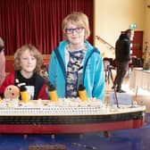 The most popular exhibit at the Lego exhibition was the Lego Titanic. Pictured viewing the piece are Carolyn Flanagan and children, Matthew (8) and James (11). PT15-205.
