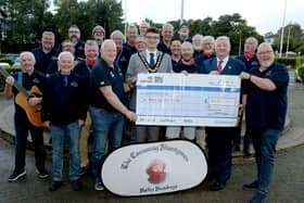 Mayor of Causeway Coast and Glens, Councillor Ciarán McQuillan and Councillor Steven Callaghan, pictured with The Causeway Shantymen as they present a cheque to John Martin, RLNI, with money raised over the summer from their open rehearsals across the Borough. CREDIT CCGBC