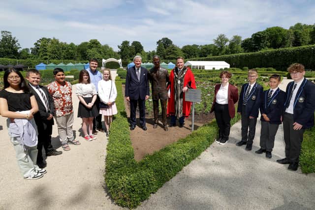 The Lord Lieutenant for Co Antrim, Mr David McCorkell KStJ and the Mayor of Antrim and Newtownabbey, Councillor Mark Cooper BEM, with participants from the 2022/2023 Duke of Edinburgh Legacy Bursary Scheme at the unveiling of the sculpture.