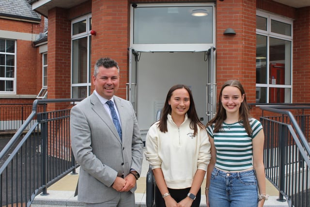 Mr McCullough, principal, of Rainey Endowed School with two pupils who achieved 4A Grades-AS.