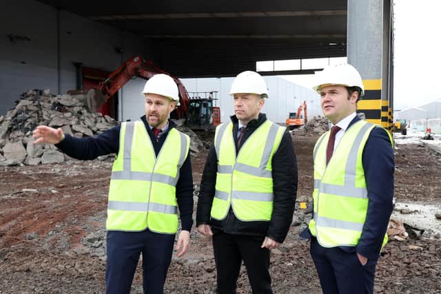 Ryan McCaughran, Monster project manager; Rt Hon Secretary of State for Northern Ireland Chris Heaton-Harris MP and Miles Karemacher, General Manager of Coca-Cola HBC Ireland and Northern Ireland pictured at the Knockmore Hill, Lisburn Production Facility. Picture: Press Eye