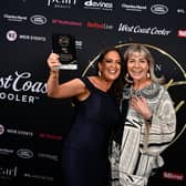 Dr Carla Devlin from Berkeley Aesthetics is presented with the trophy for Mobile  Home-Based Specialist Business of the Year from Kerry Patterson of DermaFrac UK, event partner of NI Beauty Excell