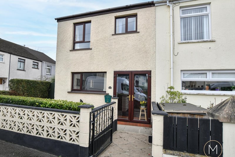 This well-appointed end terrace property in a sought after location features a welcoming entrance porch and a spacious hallway with storage. There is a downstairs WC, bright living room, a sunroom with sliding patio doors to the back garden, and a fitted kitchen with dining area. With four well proportioned bedrooms and a fitted bathroom with a white suite, the property also benefits from oil fired central heating, double glazed windows, a private front garden with a variety of plants and shrubs, and an enclosed rear garden area with a flagged patio. It is on the market for offers over £125,000 with McAllister Estate Agents.