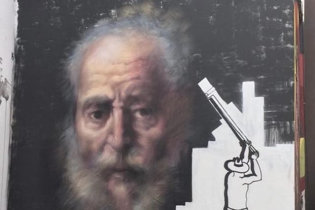 Situated right next to Conor’s piece (shown above), Whitewashing A Rembrandt is part of PANG’s ‘Miniature Assholes’ series, jostling the differences of contemporary and classical artwork.

Her mural shows a traditional image being taken over by what is now more commonly seen in the modern street art scene.