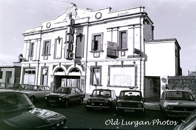 This photo from the early 1980’s is of the old Lyric Cinema that once stood in Union Street. In its heyday the old Lyric Cinema was the place to be, during the 50’s and 60’s especially. Crowds were steaming onto the street, the venue was that popular. Many a relationship that resulted in marriage was initiated in the stalls or flea pit of the Lurgan cinema. ‘Coorting’ was plentiful when Elvis Presley or John Wayne was on. A ‘quid’ got you a seat in the Lyric, a fish supper on the way home and loose change in your pocket in those days. The Lyric was gutted in a fire bomb attack in 1974 and the proprietors, Solar Cinemas, said they would not reconsider opening it again until the Troubles waned sufficiently. However, in 1979, the owners did not see it as a profitable proposition for them to rebuild the cinema and decided the best option was to sell the site.  The derelict building was finally pulled down in the early 1980’s.