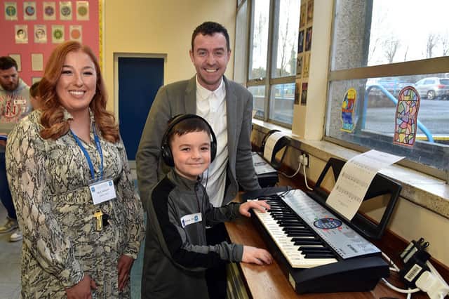 Head of Music at St John the Baptist's College, Mrs Kirsty McGrath pictured during the school open day with prospective student, Rylee McCann (10) and his dad, Gary. PT03-202.
