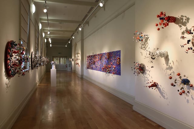 Situated on the first floor of Queen’s University’s Lanyon Building, the Naughton Gallery promotes diversity, inclusivity, and artistic excellence. 
Presenting a programme consisting of contemporary exhibitions, local and internationally renowned artists, talks, screenings, and special events, the gallery is a hub of cultural and artistic expression. A range of art is represented in the gallery, including paintings, prints, works on paper, sculpture, furniture, metalwork, and silver.
With free admission and open six days per week, the Naughton Gallery has been recognised as one of the leading university galleries in the UK and Ireland, making it well worth the visit.
For more information, go to naughtongallery.org