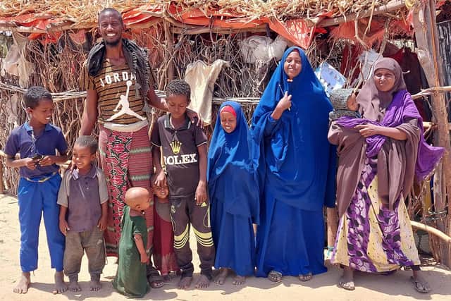Ambiyo, her husband Mahat, and their children, who featured on this year’s Trócaire Box, outside their shelter in the Boyle IDP camp in Gedo region, Somalia.