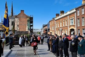 The deputy First Minister was among local dignitaries to lay poppy wreaths at Lisburn's war memorial to mark 80 years since VE Day.