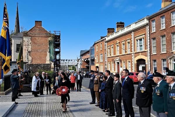 The deputy First Minister was among local dignitaries to lay poppy wreaths at Lisburn's war memorial to mark 80 years since VE Day.