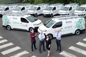 Housing Executive Chair Nicole Lappin inspects the organisation’s new fleet of 10 electric vans along with staff members (l-r) David Roe, Fleet Support Operations Manager,
Stephen Moore, Assistant Director of the Direct Labour Organisation (DLO), and John Lamont, DLO Operations.