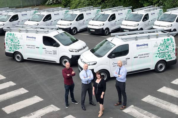 Housing Executive Chair Nicole Lappin inspects the organisation’s new fleet of 10 electric vans along with staff members (l-r) David Roe, Fleet Support Operations Manager,
Stephen Moore, Assistant Director of the Direct Labour Organisation (DLO), and John Lamont, DLO Operations.