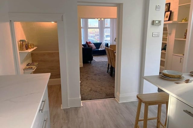 View of the kitchen through to the dining area and lounge.