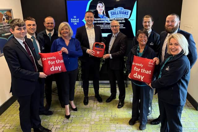 The Bank of Ireland Andersonstown branch team at the launch of the new community defibrillator at Bank of Ireland’s Andersonstown branch.
