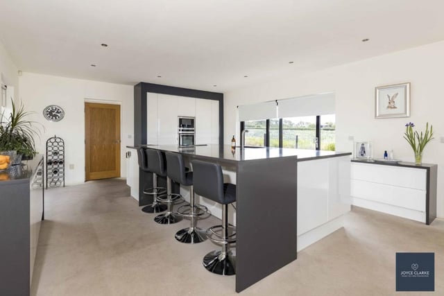 The magnificent open plan kitchen, dining and living area inclues a large island offering an exceptional workstation for both food preparation and dining.