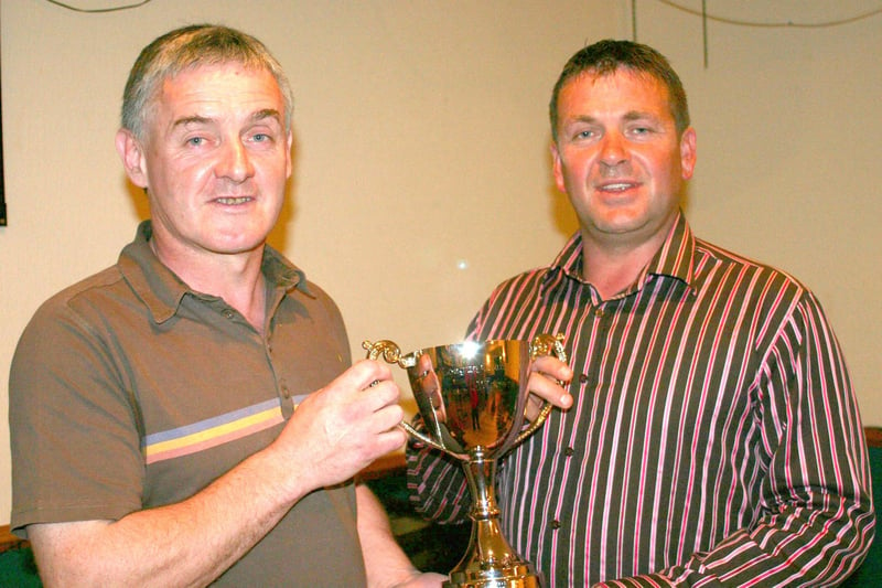 A proud Joe Patton and Gary Lyttle celebrate their annual dinner in 2008 at The Bush Tavern by displaying the Hutchinsons Tiles League trophy which their club, The Taverners, won