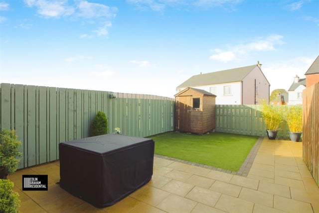 Enclosed back garden with patio area.