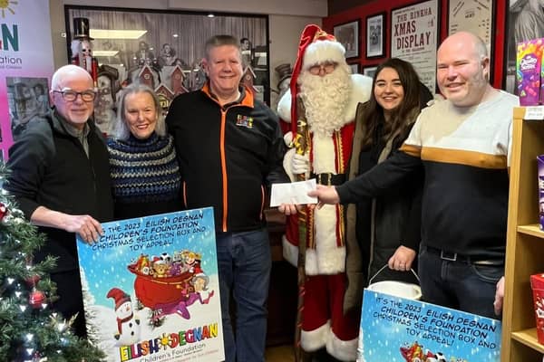 Gerald Degnan, from the Eilish Degnan Children's Foundation, receives a cheque from the Rinkha team and Santa. Photo submitted by G Degnan