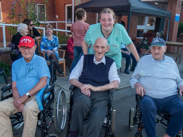 Posing for the camera at the vintage rally are Mahon Hall residents from left, William Bullick, Ronnie Bothwell and Kenny Troughton. Also included is care assistant Amy Clarke.