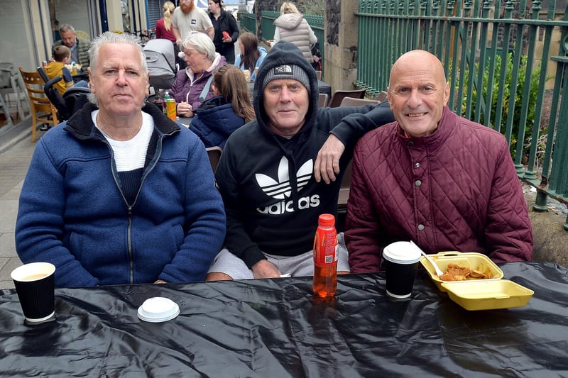 Taking a lunch break at Country Comes To Town are, from left, Robert Knipe and Terence and Roy McLean. PT38-215.