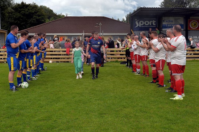 The Just A Chat team received a guard of honour as they took to the field on Sunday morning. LM32-211.