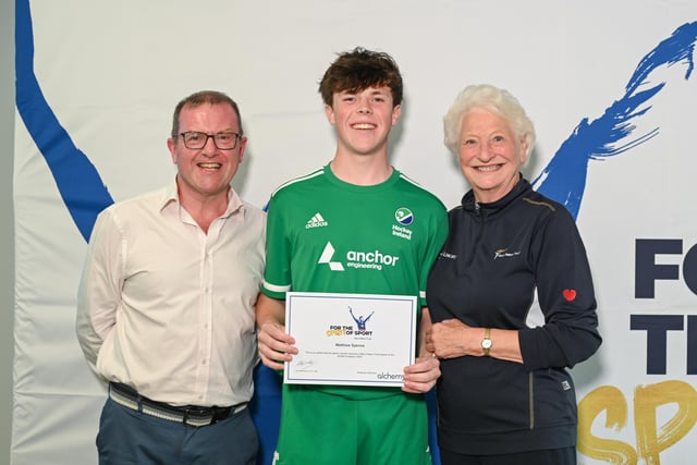 Hockey player Matthew Spence, from Waringstown, receiving his award certificate from Barry Funston and Lady Mary Peters. Photo submitted by Mary Peters Trust