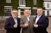 Co-owners Darryl McNally and Adrian McLaughlin toast the official opening of the Harbourview Hotel in Carnlough with general manager, Paul Truscott.  Picture: Bradley Quinn