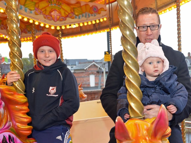 Philip and Eve Carmichael and Jayden Kyle have fun at the Whitehead Victorian street fair in 2015. INCT 48-033-PSB