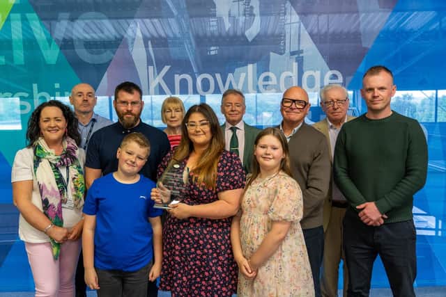 Kellie-Ann with college staff Gemma McGranaghan and Martin Hay, Kellie-Ann's son and daughter Kobi and Lola Burgess, Kellie’s partner James Spurle, Stephanie McMullan, Liam McMullan, Tom McMullan, Paul Stinson and Andrew MacAuley. Photo submitted.