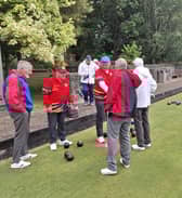 Stewart Martin and Billy Martin, respective of Lurgan Red and Portadown shaking hands at the conclusion of their Veteran's match won by Portadown and played extremely challenging weather conditions
