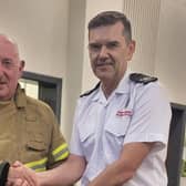 Crew Commander John McLaughlin from Ballymoney Fire Station was presented with his Fire Service 30 years service clasp by Area Commander Marcus Wright. CREDIT NI FIRE AND RESCUE SERVICE