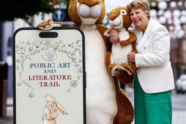 Maralyn McBratney officially opened the Guess How Much I Love You Public Art and Literature Trail in Lisburn City Centre with the assistance of Big Nutbrown Hare and Litlle Nutbrown Hare. Pic credit: Lisburn & Castlereagh City Council
