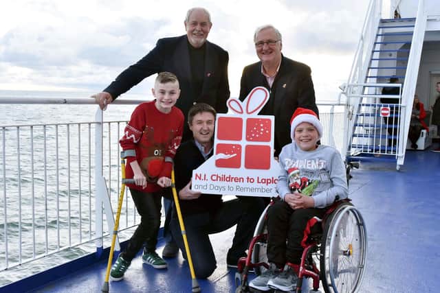 Oliver Dickey and Ethan Pollock on the Northern Ireland Children to Lapland Trust’s Walk To Scotland fundraiser in 2019. They are pictured with (from left to right) Gerry Kelly; president; Jim Burke, board member and Colin Barkley, chair, all NICLT.