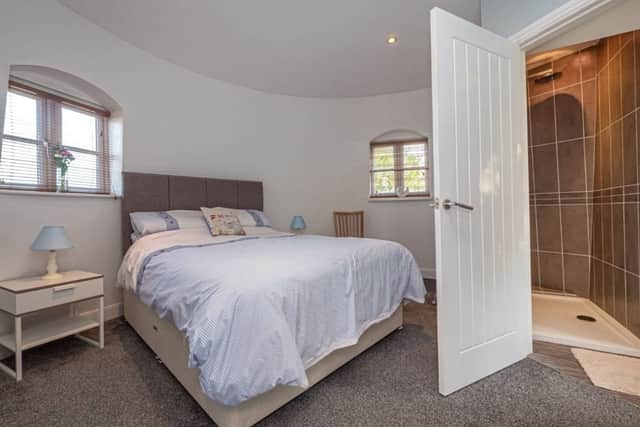 One of the two bedrooms in the windmill, complete with curved walls. (Picture: Reeds Rains)