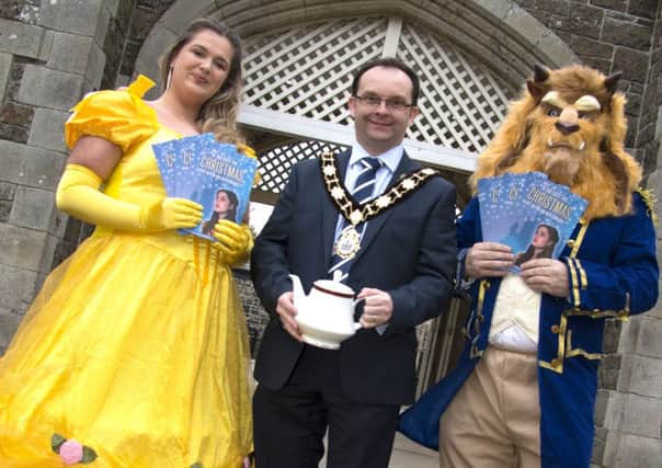 Beauty and the Beast welcome the Mayor, Councillor Paul Hamill, to the Beast's Mansion to launch Glengormleys Christmas switch on event.