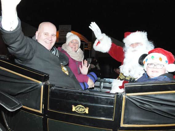 Mayor of Mid and East Antrim Council, Rev. Paul Reid, Santa and party wave from their Horse drawen carriage
