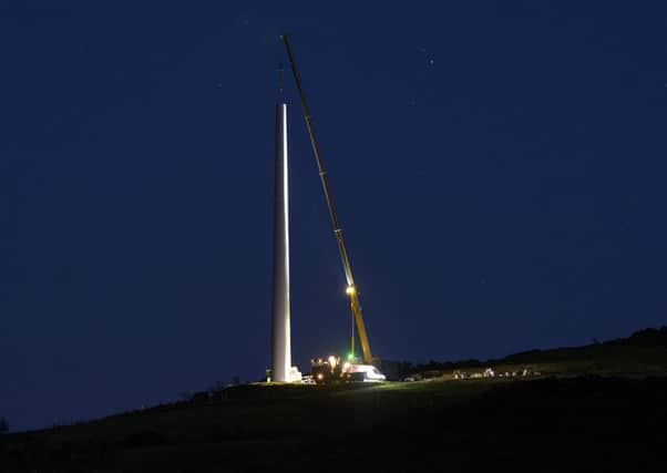 Work to install the wind turbine at Knock Iveagh near Rathfriland continued after dark last Thursday evening. Photo by Paul Byrne